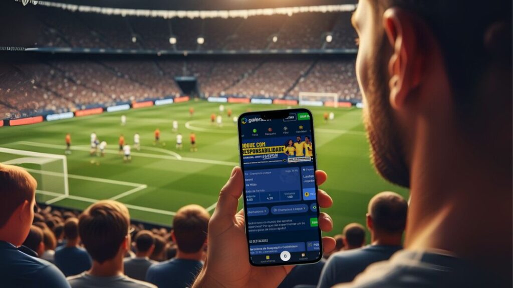 Pessoa assistindo jogo de futebol no celular